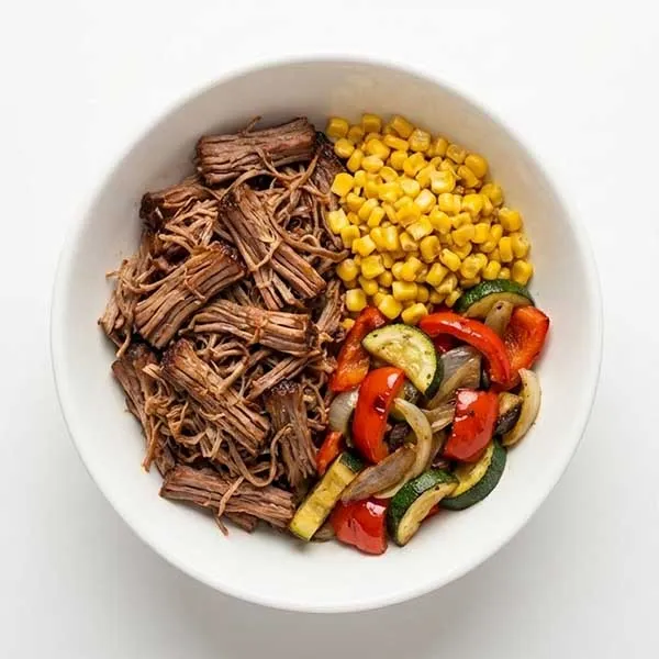 BBQ Pulled Beef Brisket with Savory Corn and Vegetable bowl